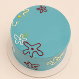 Mini Sugar Sweet turquoise-blue celebration cake with colorful abstract flower decorations