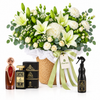 Asser and Ashek Al Oud perfumes with Ashiq Aloud air freshener beside a Flowrista white flower basket