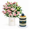 Giovanni blue and white Khufu chocolate pyramid beside Flowrista pink carnation and white lily flower box