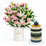 Giovanni blue and white Khufu chocolate pyramid beside Flowrista pink carnation and white lily flower box