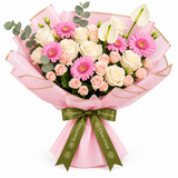 Flowrista pink gerberas cream and blush roses white anthuriums and eucalyptus in pink wrapping