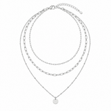 Silver-tone layered necklace with round pendant on white background