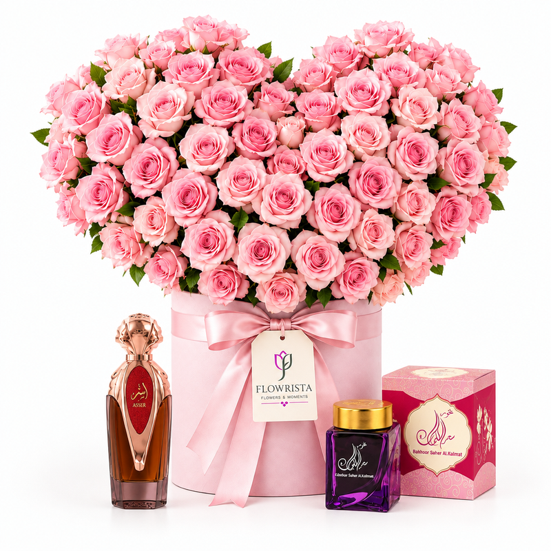 Asser perfume and Bakhoor Saher Alkalmet beside Flowrista heart-shaped pink roses in a pink box