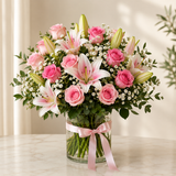 Luxury pink roses and stargazer lilies bouquet in glass vase with pink satin ribbon, Dubai flower delivery
