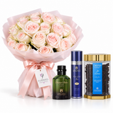 A gift set featuring a large bouquet of light pink and white roses wrapped in pink paper, accompanied by a green Cologne Eden Wood scent bottle, a blue and silver perfume bottle, and a gold-lidded jar of Amber Flavors chocolate.