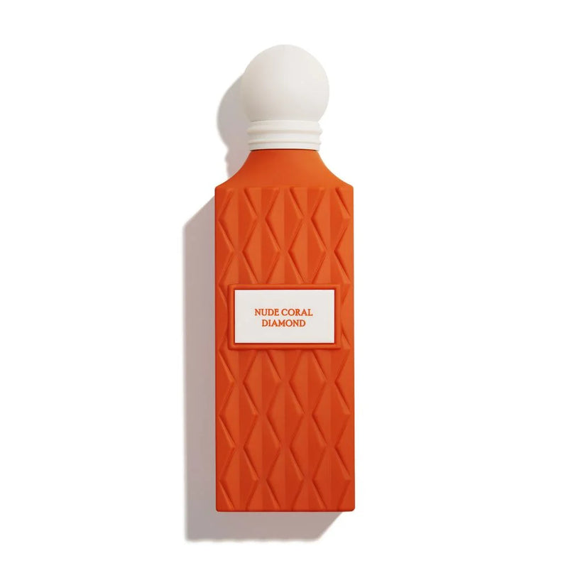 Orange perfume bottle with white cap on a white background