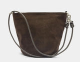 A dark brown suede bucket bag with a thin gray shoulder strap and silver-tone hardware, shown against a plain white background.