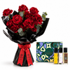 A bouquet of 24 red roses with green eucalyptus stems, wrapped in black paper with a red ribbon, displayed next to a 'Flowerilla Collection' perfume gift set containing three small fragrance bottles and a decorative box.