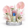 Al Khitam Musk perfume oil by Abdul Samad al Qurashi with pink anthurium, ranunculus, allium and pampas grass in Flowrista silver mirrored tray — luxury floral gift set Dubai