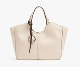 A structured off-white leather tote bag with dark brown leather handles and a matching hanging ring charm, shown against a plain white background.