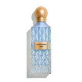 Perfume bottle with geometric design and gold cap on a white background