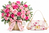 A large pink rose flower bouquet in a wicker basket with a pink ribbon bow and tags, displayed next to a white floral shoulder handbag with gold hardware on a clean white background. The tags show the brand name FLOWPISTA.