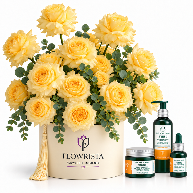 A gift set featuring a large arrangement of yellow roses in a cream-colored round box with a tassel and the 'FLOWRISTA' logo, alongside three skincare products from 'The Body Shop' including Vitamin C body wash, Vitamin C serum, and Vitamin C hand cream, all set against a plain white background.