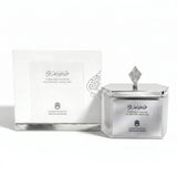 Silver incense container with decorative design and white box on a white background