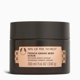 A dark brown jar of Spa of the World French Grape Seed Scrub with a beige label, set against a plain white background.