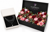 A luxury gift set from Flowrista featuring a silver layered necklace in an open white box alongside a large black box filled with preserved roses and flowers.