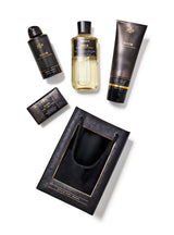 Collection of Noir grooming products including bottles and a pouch on a white background