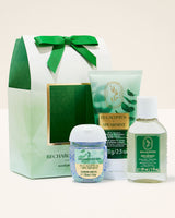 Eucalyptus-themed skincare products including a bottle, tube, and small container with a green and white color scheme.