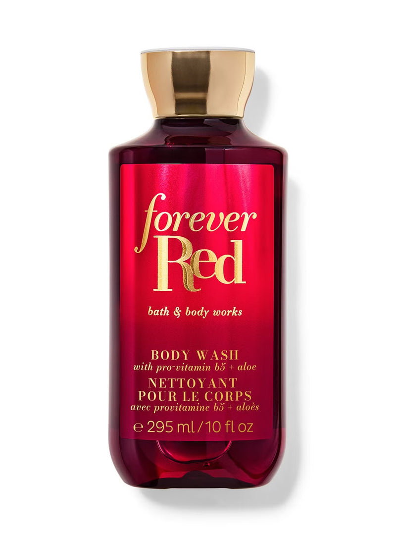 A bottle of Bath & Body Works Forever Red body wash, featuring a deep red label with gold lettering and a metallic gold cap, set against a plain white background.