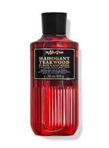 Red bottle of Mahogany Teakwood 3-in-1 hair, face, and body wash by Bath & Body Works on a white background