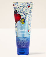 Tube of Snow White body cream with decorative design on a white background