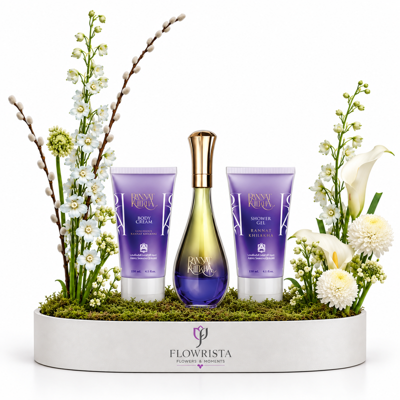 FLOWRISTA Flower Power Hand & Body Care set including a shower gel bottle and two hand/foot care tubes, styled in a white tray with green moss and white flowers on a white background.