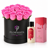 A gift set featuring a round black box of 15 vibrant pink roses by Flowrista, alongside a bottle of Viva Hibiscus body wash and its pink packaging box, all set against a clean white background.