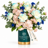 Cream roses with blue accents and blush flowers in dark teal Flowrista box