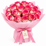 Flowrista cream roses with vivid pink edges in pink wrapping and matching bow