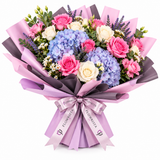 Flowrista bouquet of pink roses, lilac-blue hydrangeas and cream flowers in pink and purple wrapping