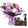 Ashek Al Oud bakhoor and Ashiq Aloud air freshener beside a hydrangea and pink rose bouquet