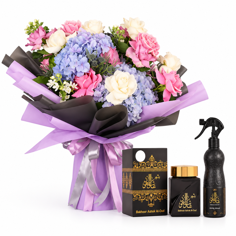 Ashek Al Oud bakhoor and Ashiq Aloud air freshener beside a hydrangea and pink rose bouquet