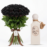 Riviera Sunset perfume beside a black rose bouquet with brown ribbon and Flowrista gift tag