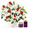 Saher Alkalmet bakhoor and mamoul beside Flowrista red roses and white lilies in a white pot