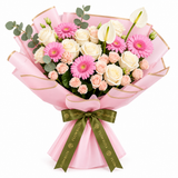 Flowrista pink gerberas and white roses with pale pink spray roses and white anthuriums in pink wrapping