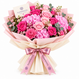 Flowrista hand bouquet of pink roses, hydrangeas and carnations with pink ribbon