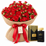 Ameer Al Oud Black Intense perfume and box beside Flowrista red rose bouquet in burlap wrapping
