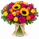 Flowrista glass vase with sunflowers, magenta, orange and yellow roses and purple flowers