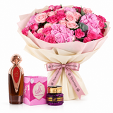 Asser perfume and Saher mamoul beside Flowrista pink rose and hydrangea bouquet