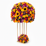 Flowrista vibrant sunflower and mixed roses flower tower on gold stand on white background