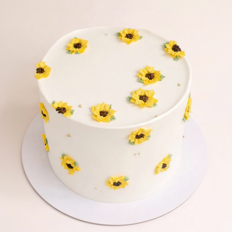 One-kilo Sugar Sweet ivory-white birthday cake with yellow sunflower decorations