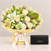ALDO Olira black wallet beside Flowrista white lily, ivory rose and pale green flower bouquet
