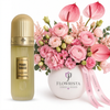 French Tobacco 100 ml perfume beside pink flowers in a white Flowrista vase with pink ribbon