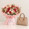 ALDO Baeli brown satchel beside a Flowrista mixed red pink and ivory roses flower box