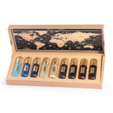 Tobacco Collection assorted perfume bottles in an open beige presentation case with world-map artwork