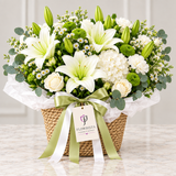 Flowrista woven basket with white lilies roses hydrangeas green chrysanthemums and eucalyptus