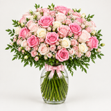 Flowrista pink and white rose bouquet in a clear glass vase