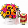 Giovanni red and gold chocolate pyramid beside Flowrista sunflower and mixed roses flower box