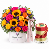 Giovanni red and gold chocolate pyramid beside Flowrista sunflower and mixed roses flower box