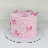 One-kilo Sugar Sweet pink celebration cake with butterfly and pearl decorations